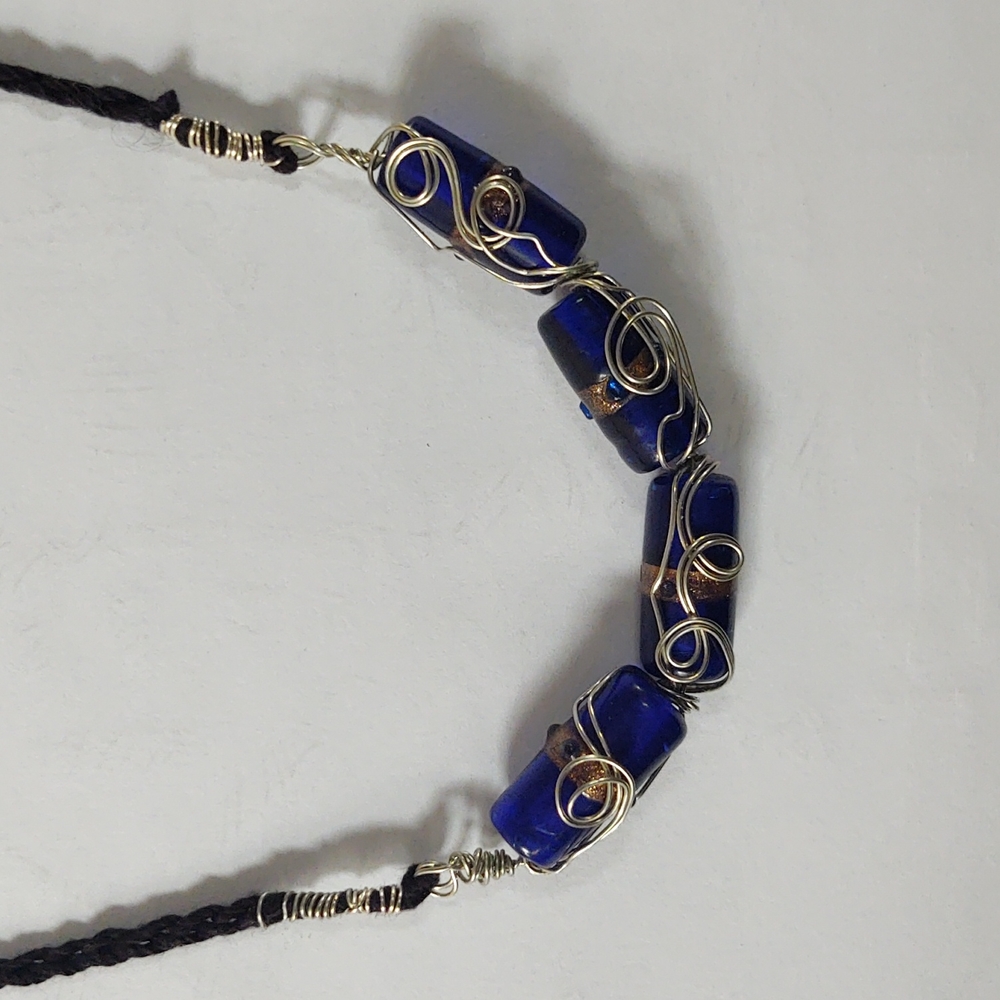 Hand crocheted blue glass beads